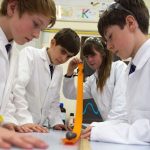 British and international exchange students in a prep school science class in England, UK